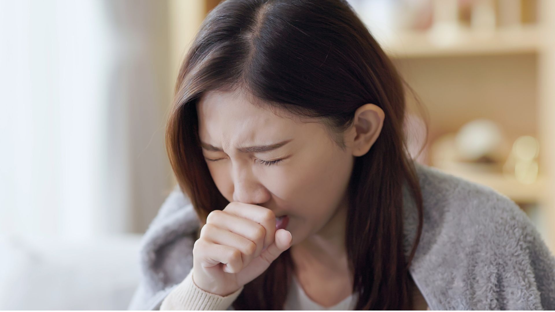 woman coughing.