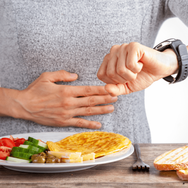 Man checking the time at his watch before eating