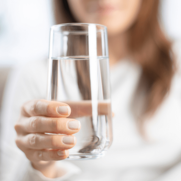 Woman holding a glass of water