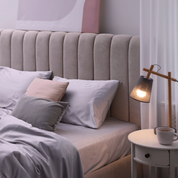 Cozy bed with a lamp