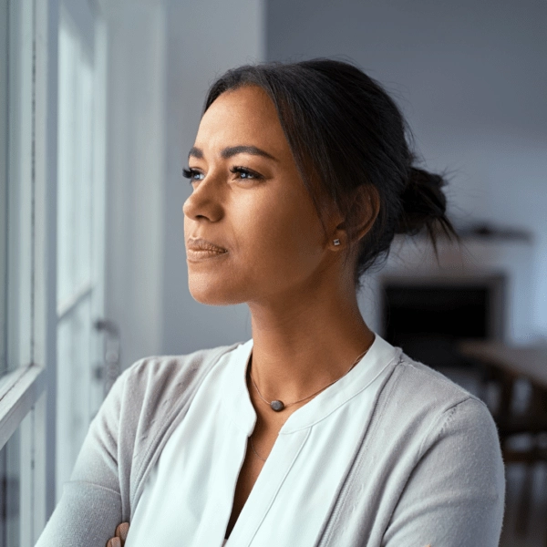 Woman looking outside the window