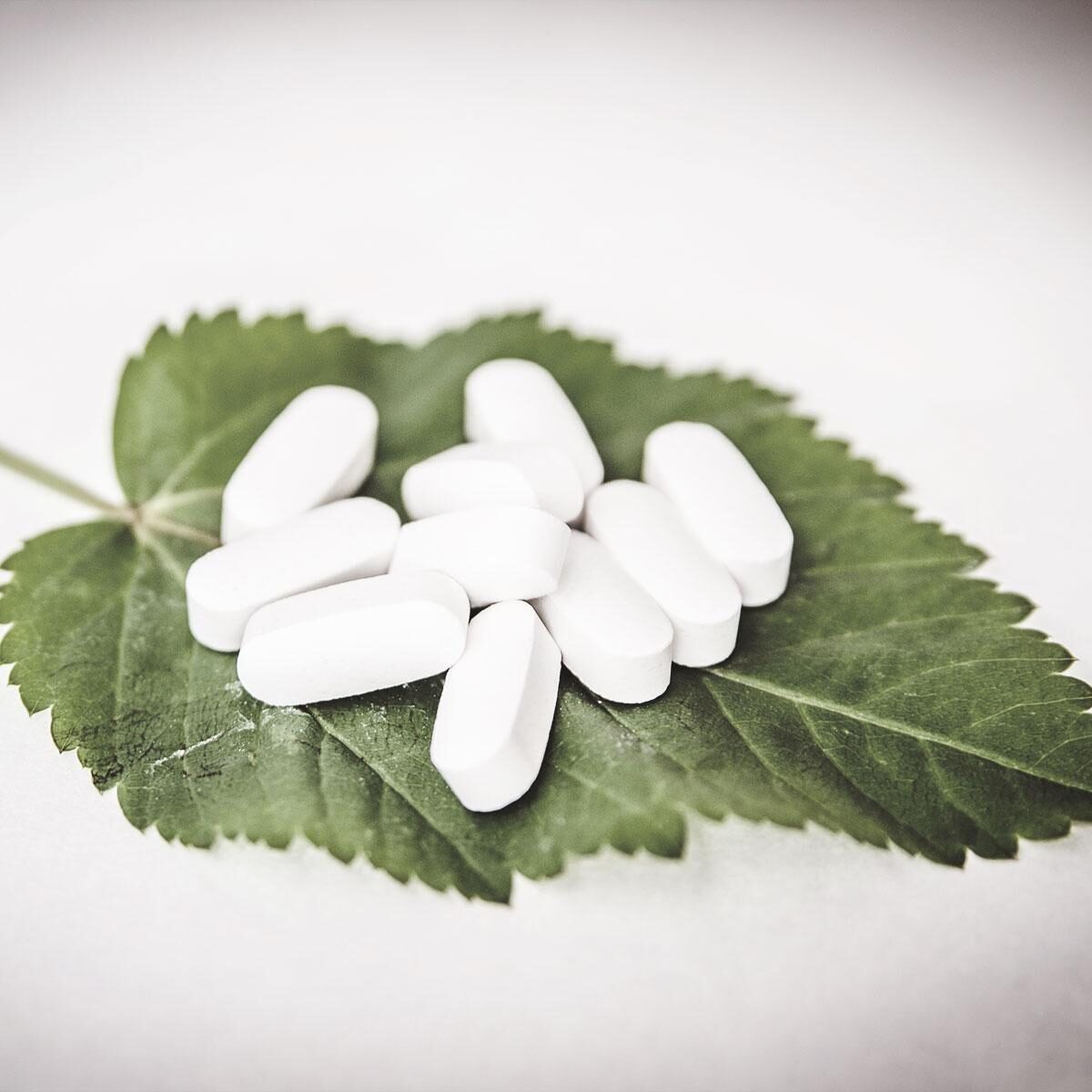 pills-on-leaf-square
