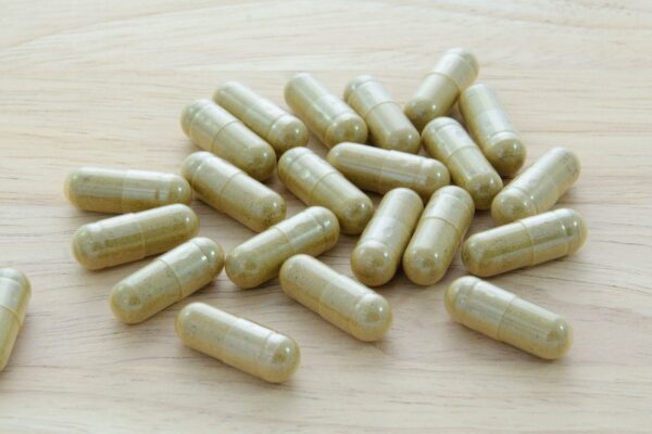Vegetable-Capsules-On-Wood