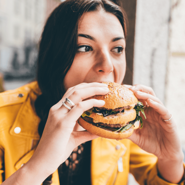 Woman stress eating burger