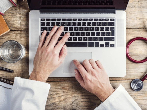 Doctor on his computer