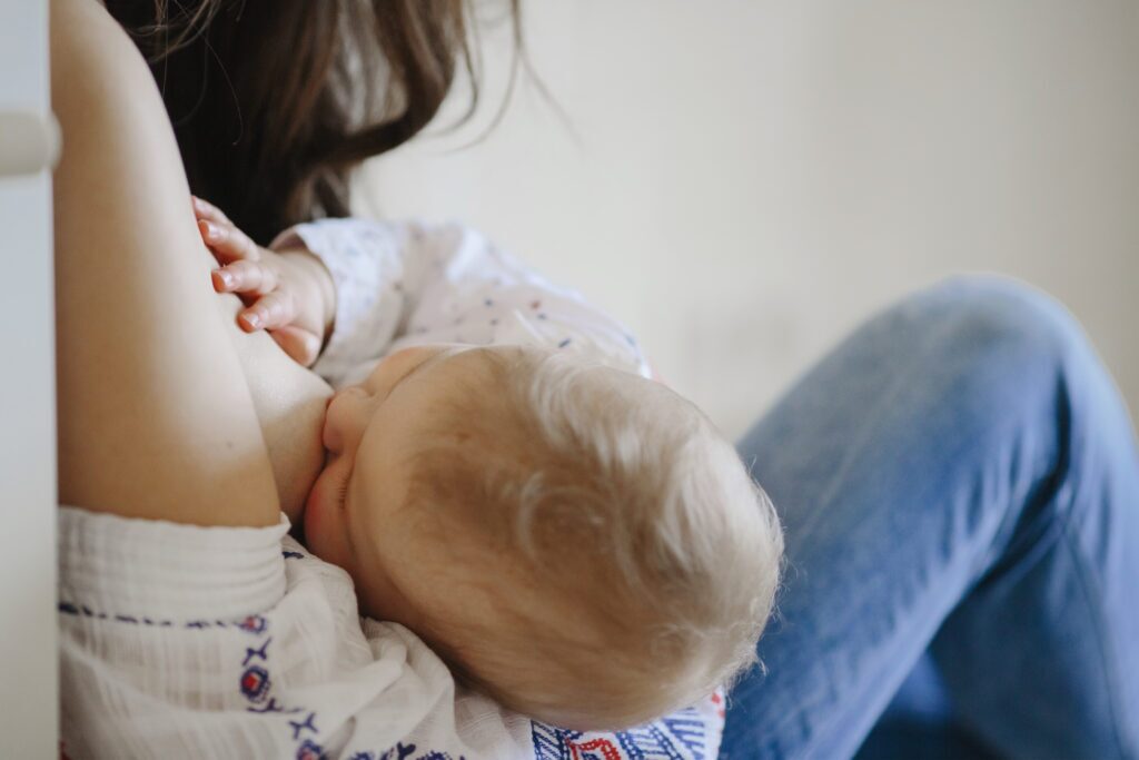 Breastfeeding mother holding her baby