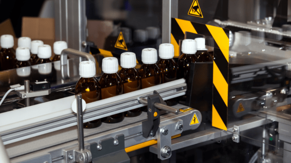 Bottles of medical pill after filling and capping