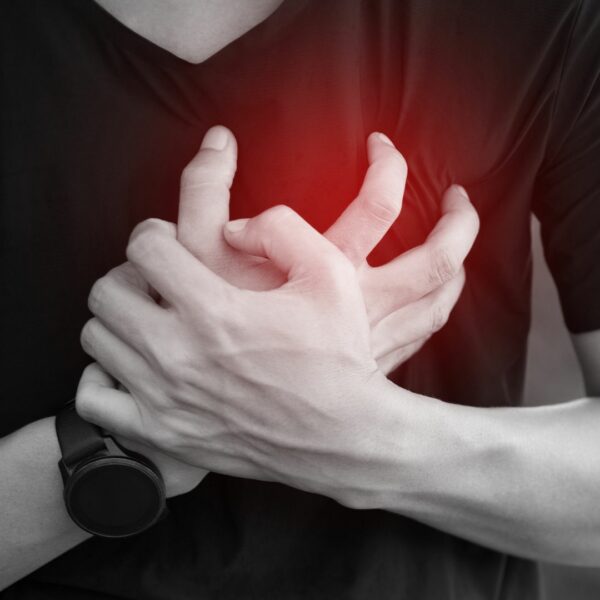 man clutching his chest