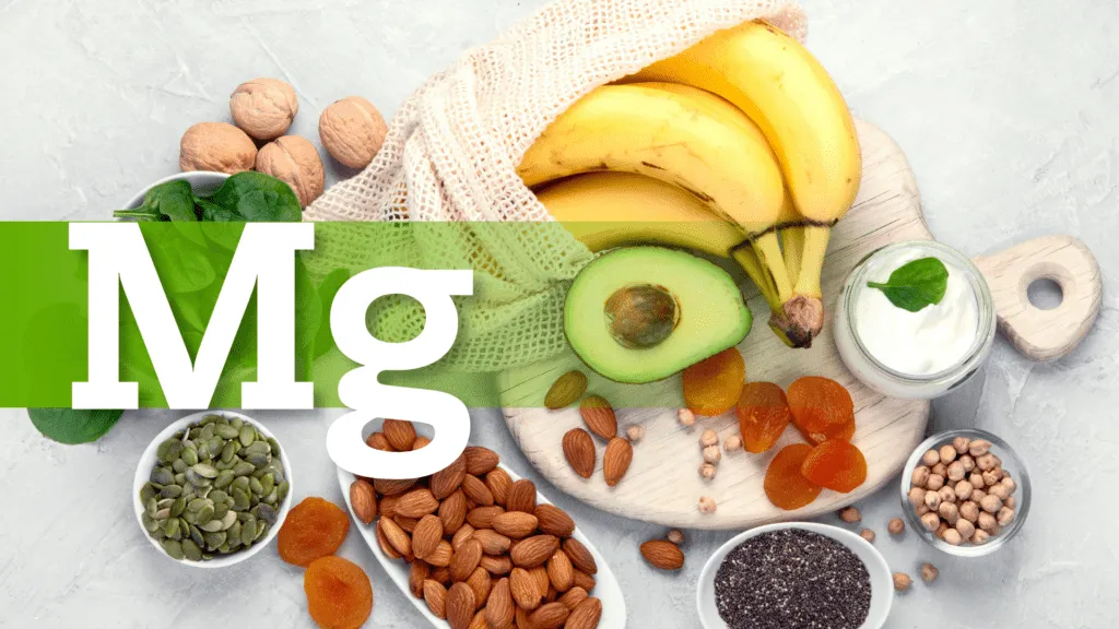Magnesium-rich foods including bananas, avocado, spinach, almonds, walnuts, dried apricots, pumpkin seeds, chickpeas, chia seeds, and yogurt displayed on a light background with the text 'Mg' highlighting magnesium benefits.