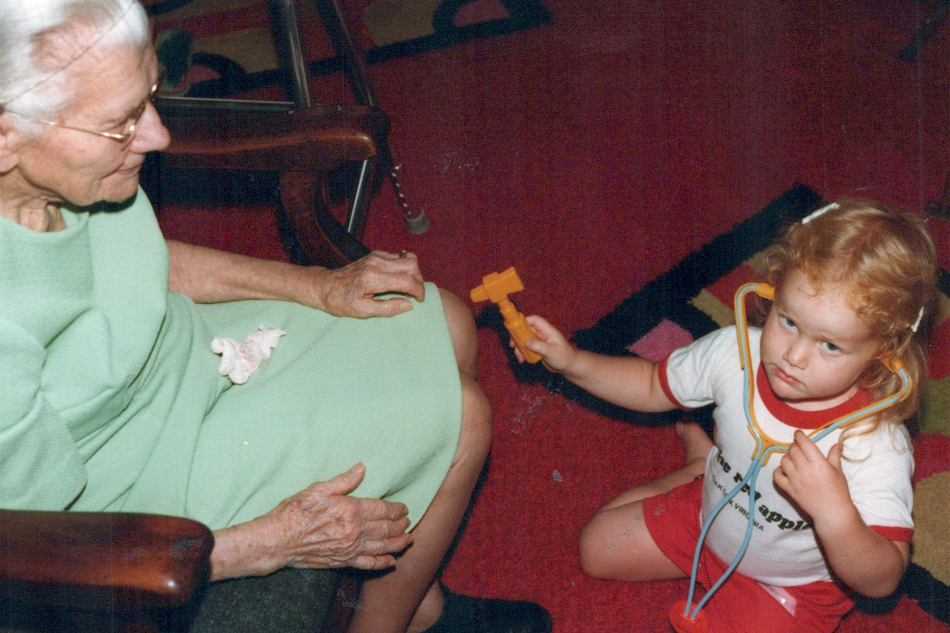 4-year-old Becky playing doctor with Grandma Perkins.