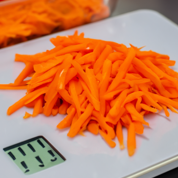 Chopped Carrots being weighed on a kitchen scale