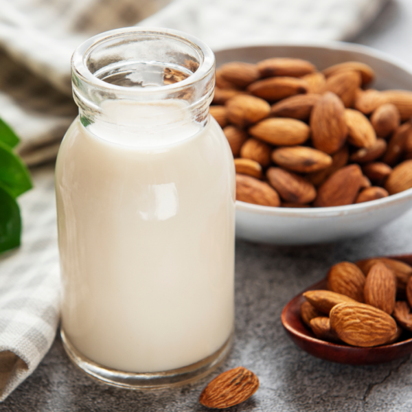 Organic Almond Milk with actual almond nuts beside it