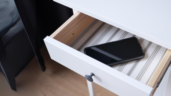 Mobile phone hidden in a drawer