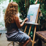 Girl painting a plant