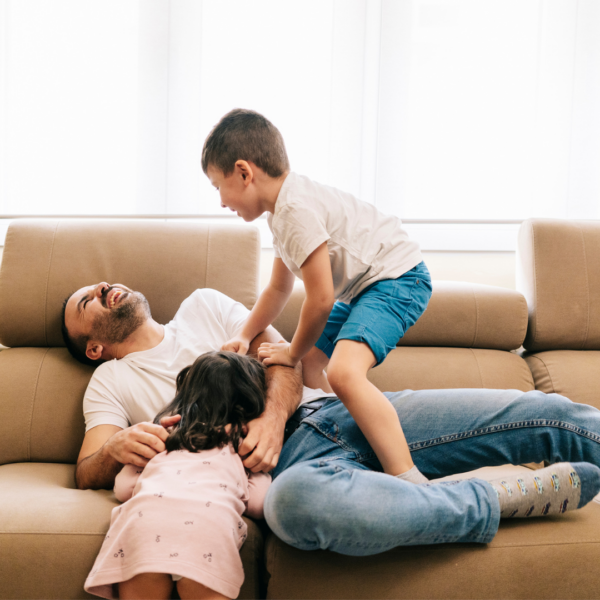 Father playing with his children