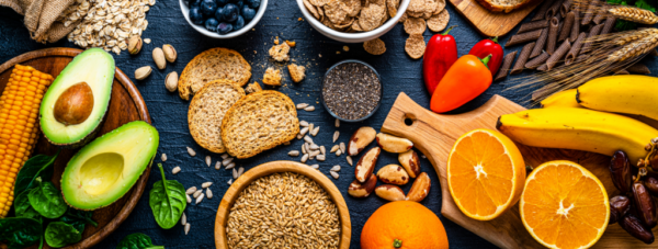 Selection of healthy carbohydrates and fiber-rich foods like grains, fruits, vegetables, and seeds, promoting balanced nutrition during menopause.