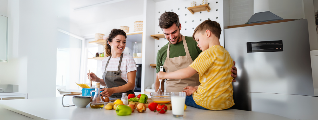 Happy family cooking healthy food