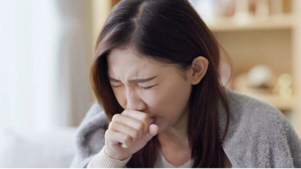 woman coughing.
