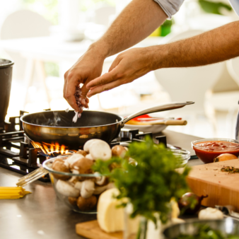 Man cooking a healthy meal at home